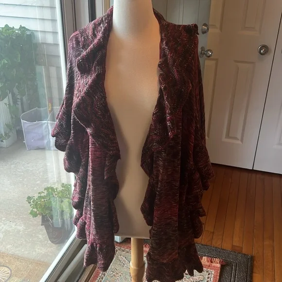 It’s a pretty ruffle cardigan open from the front. Mix of red purple white - Picture 3 of 3
